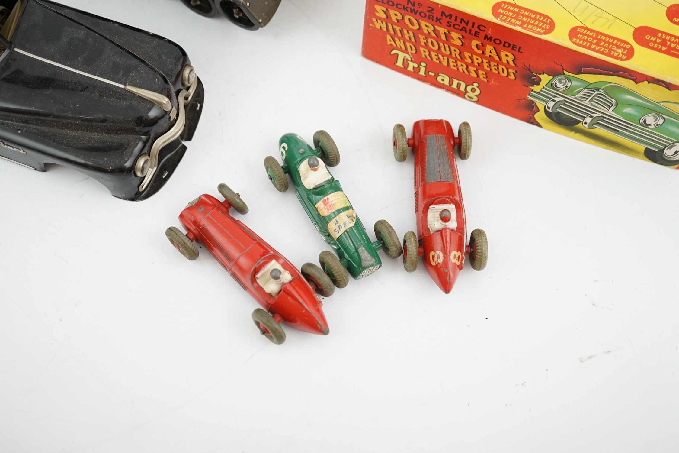 Eleven tinplate and diecast vehicles by Dinky Toys, Tri-ang, Gama, etc., including a Primal Arnold tinplate remote controlled car, a Tri-ang Minic Sports car with four speeds, a Gama Montage Tank, a Tri-ang Minic Armoure